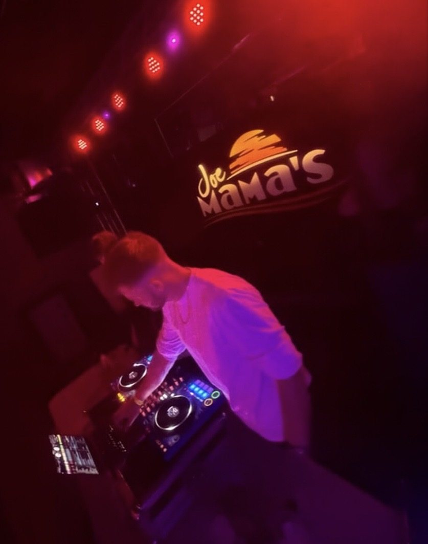 VATO performing beneath the Joe Mama's venue logo